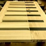 Unfinished oak flush door with six frosted glass slot inserts shown in raw wood — project 034 by Whitebird Woodcraft