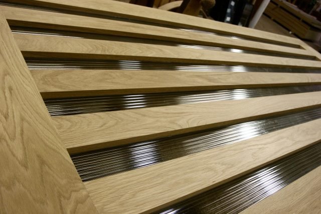 Plain sawn white oak door with fluted glass panels and oak slats creating partially divided lite effect — project 036 by Whitebird Woodcraft