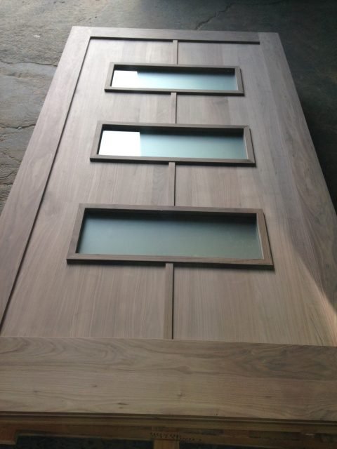 Walnut flush door with three frosted glass insets stacked vertically — project 037 by Whitebird Woodcraft