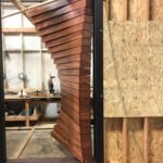 Morpheus Door test-fitted in its black steel frame in the Whitebird Woodcraft workshop before installation. Project 035